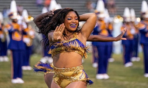 Jakayla Lofton dancing on a football field