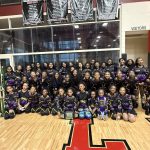 Royal Family Peoria, IL majorette dance team winners posing with their trophy