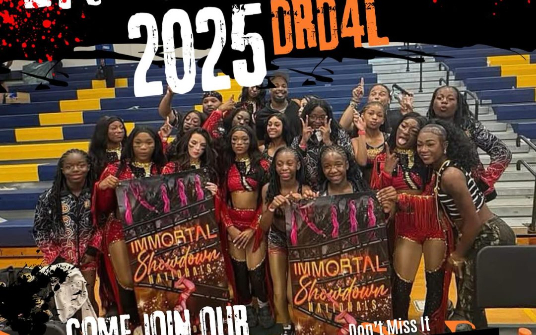 Majorette dance team celebrates a competition win by holding up a banner Dynamic Rosette Dolls of Waterbury CT