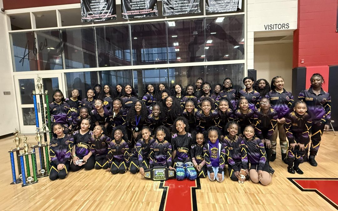 Royal Family Peoria, IL majorette dance team winners posing with their trophy